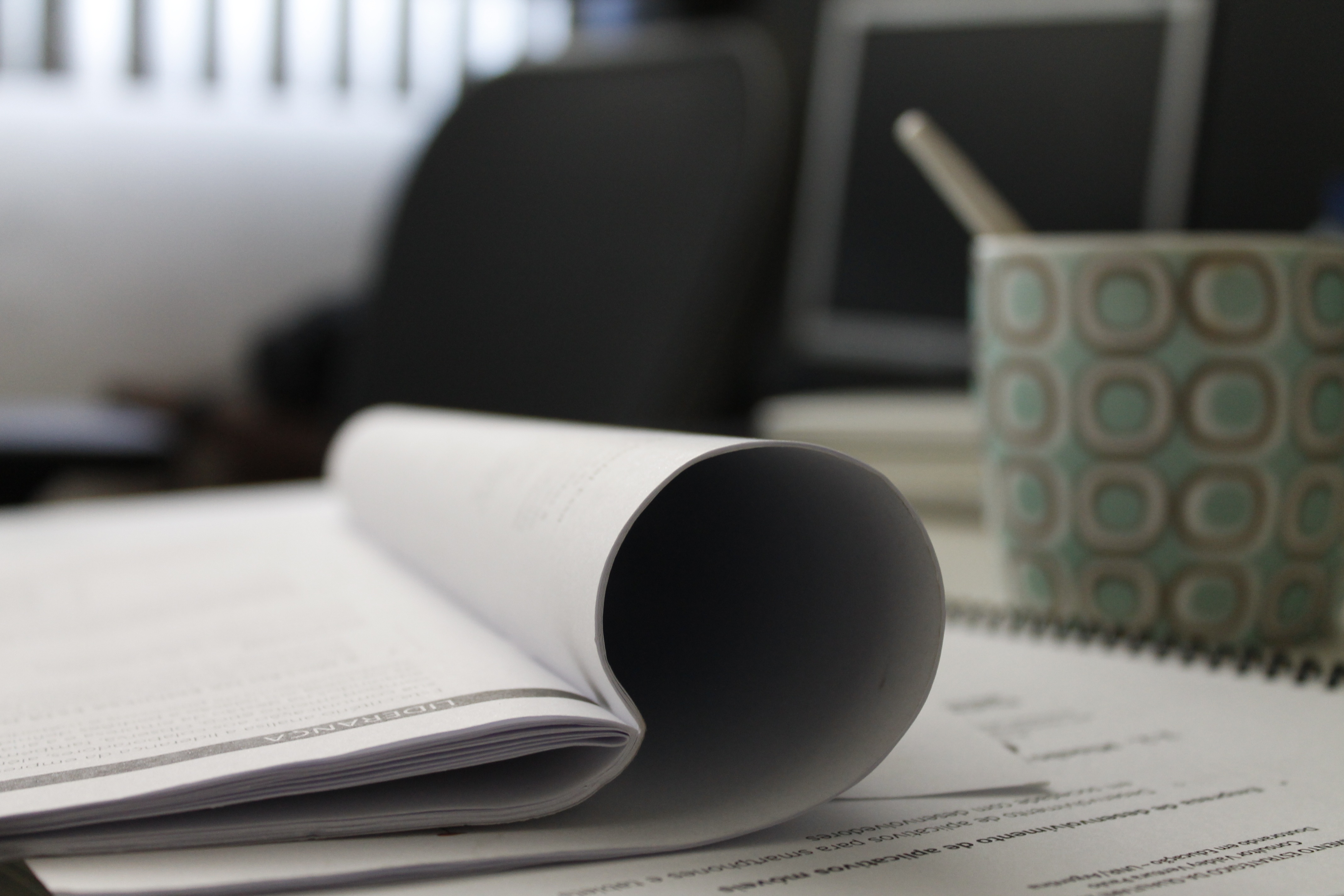 The book is on the table. Work and study. Reading Desk. Book on the Table. White book on the Table.